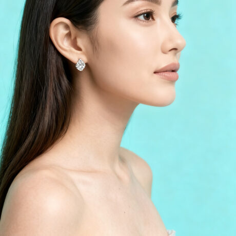 Model wearing 18K gold diamond ring and matching earrings – Adenis Jewellery luxury collection